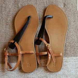 Black and tan strappy sandals